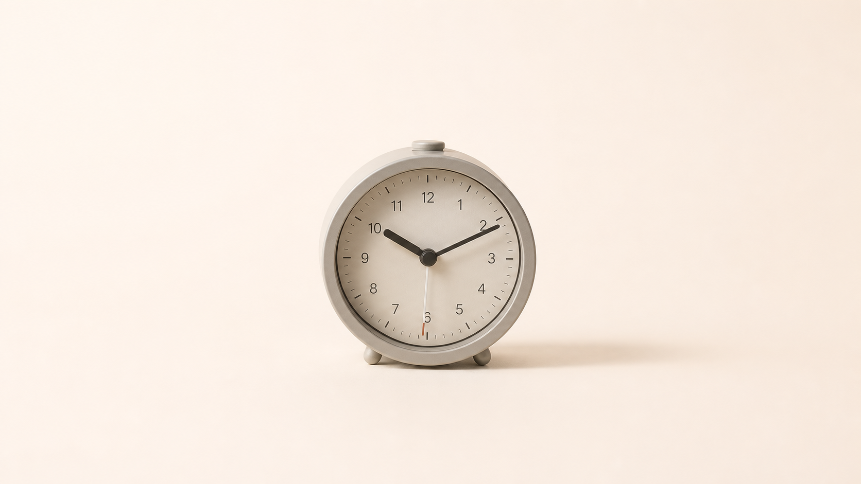 alarm clock on cream background